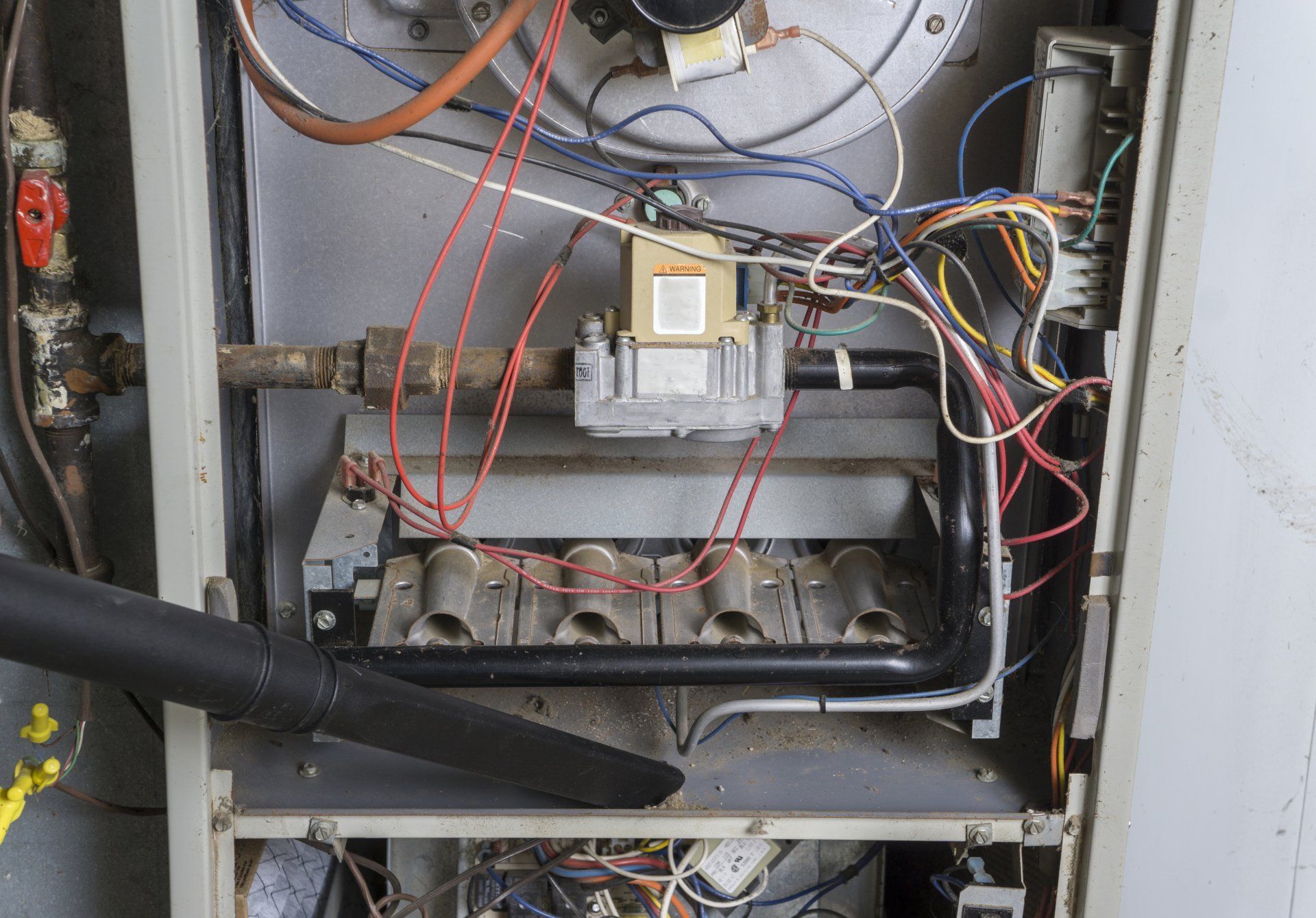 Interior heating system components inspected during furnace maintenance