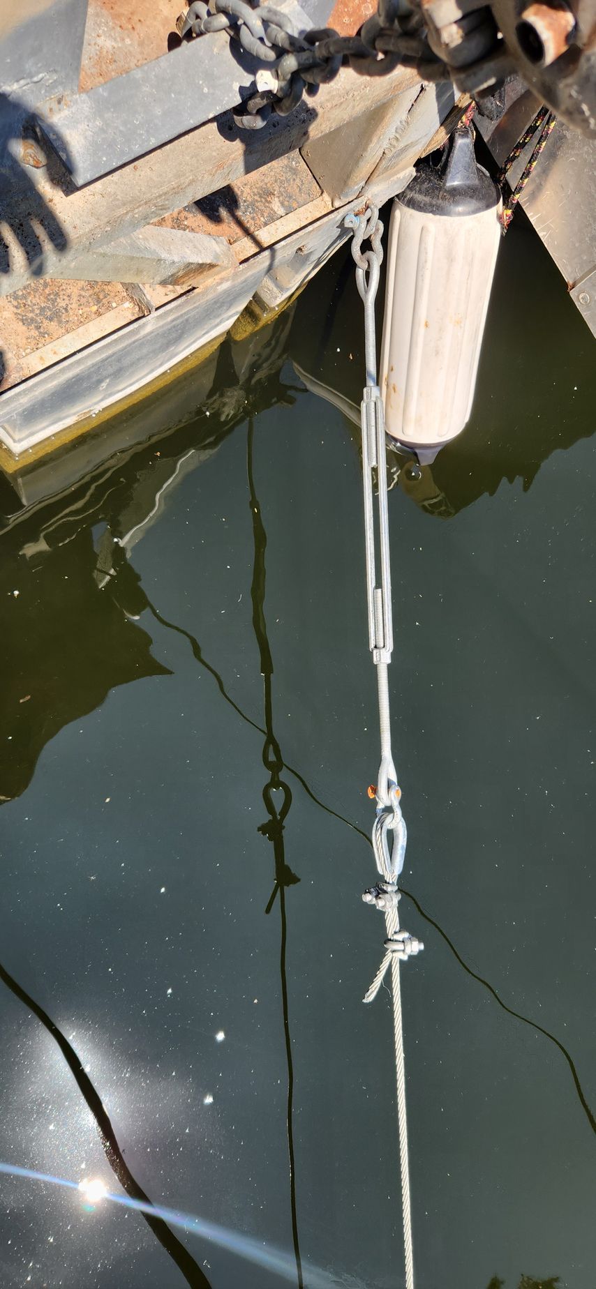 A metal structure with rope and water.