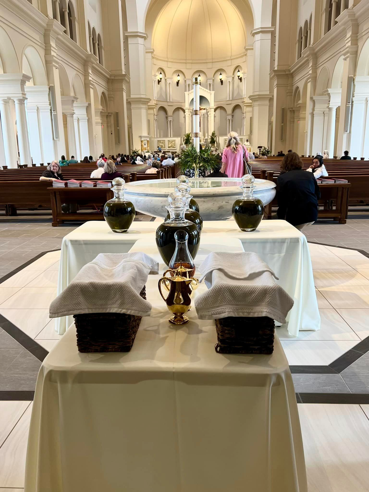 An altar in a church with baskets and bottles on it