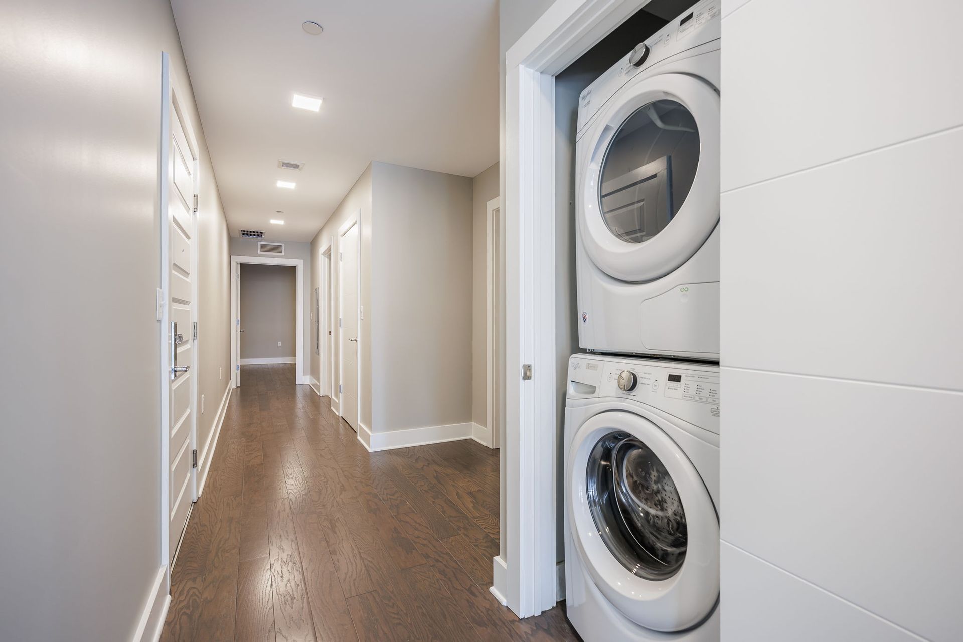 Apartment hallway with in-unit washer and dryer 