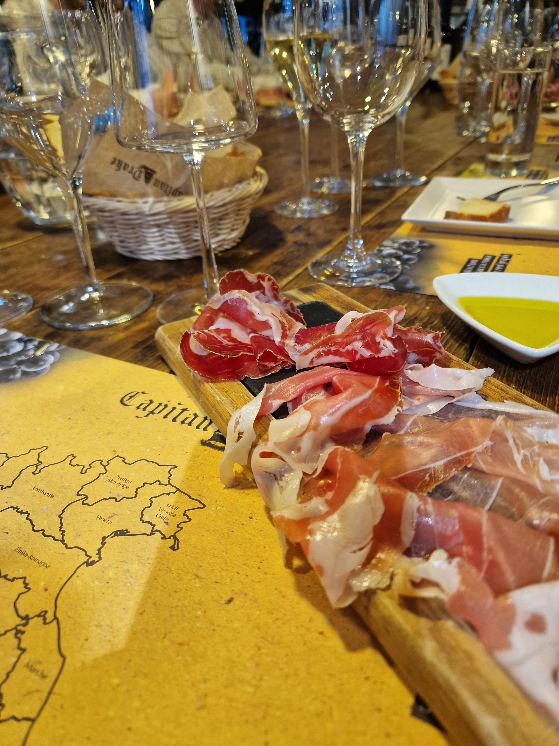 Table of cured meat and wine in Lake Como.