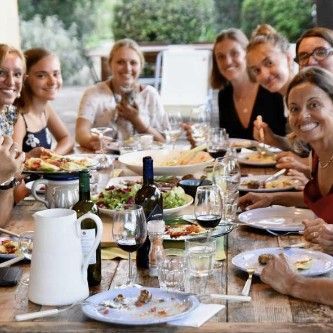 People drinking at a cooking class in Tuscany.