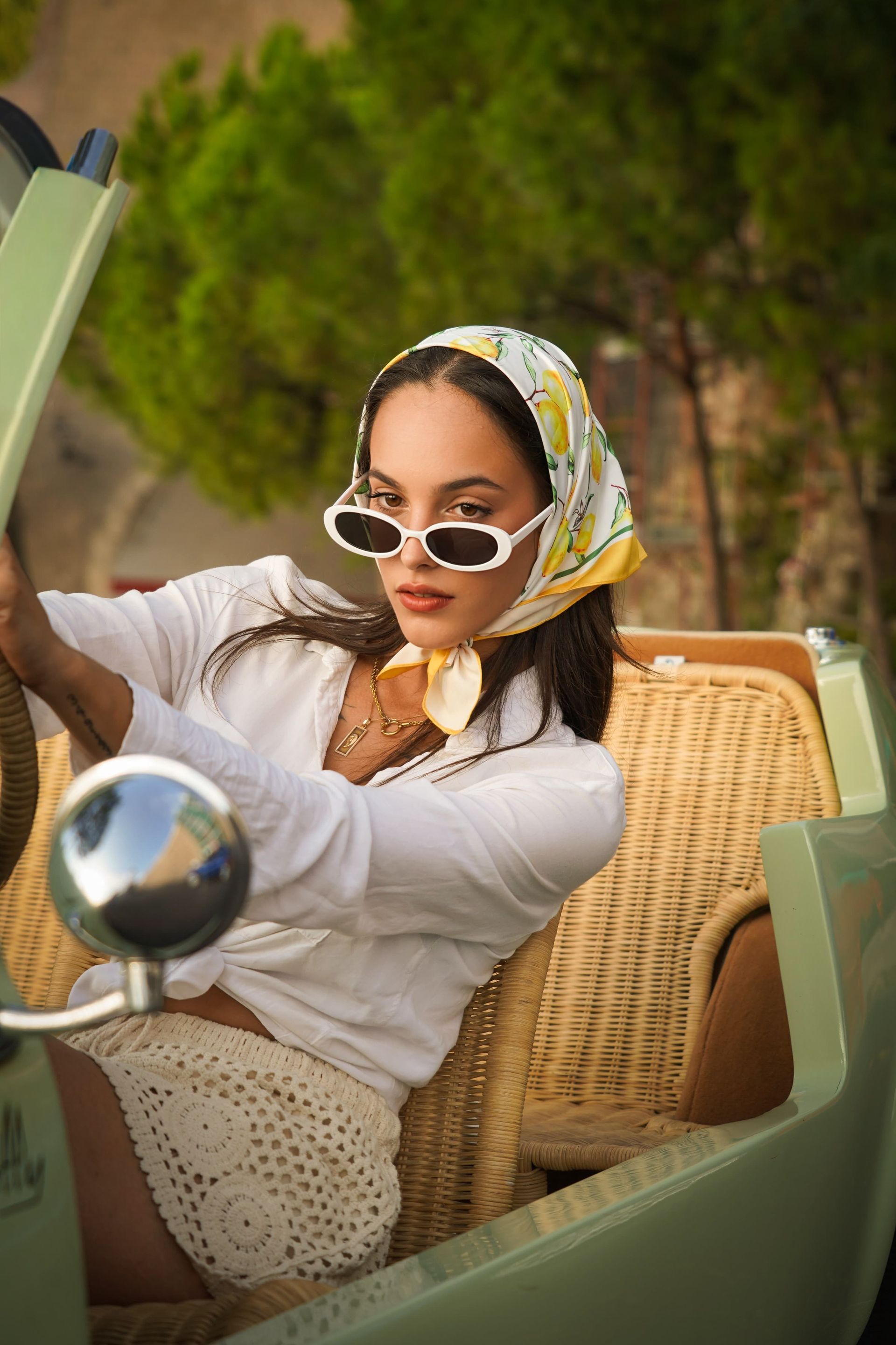 Woman driving a Fiat 500 convertible in Sorrento.