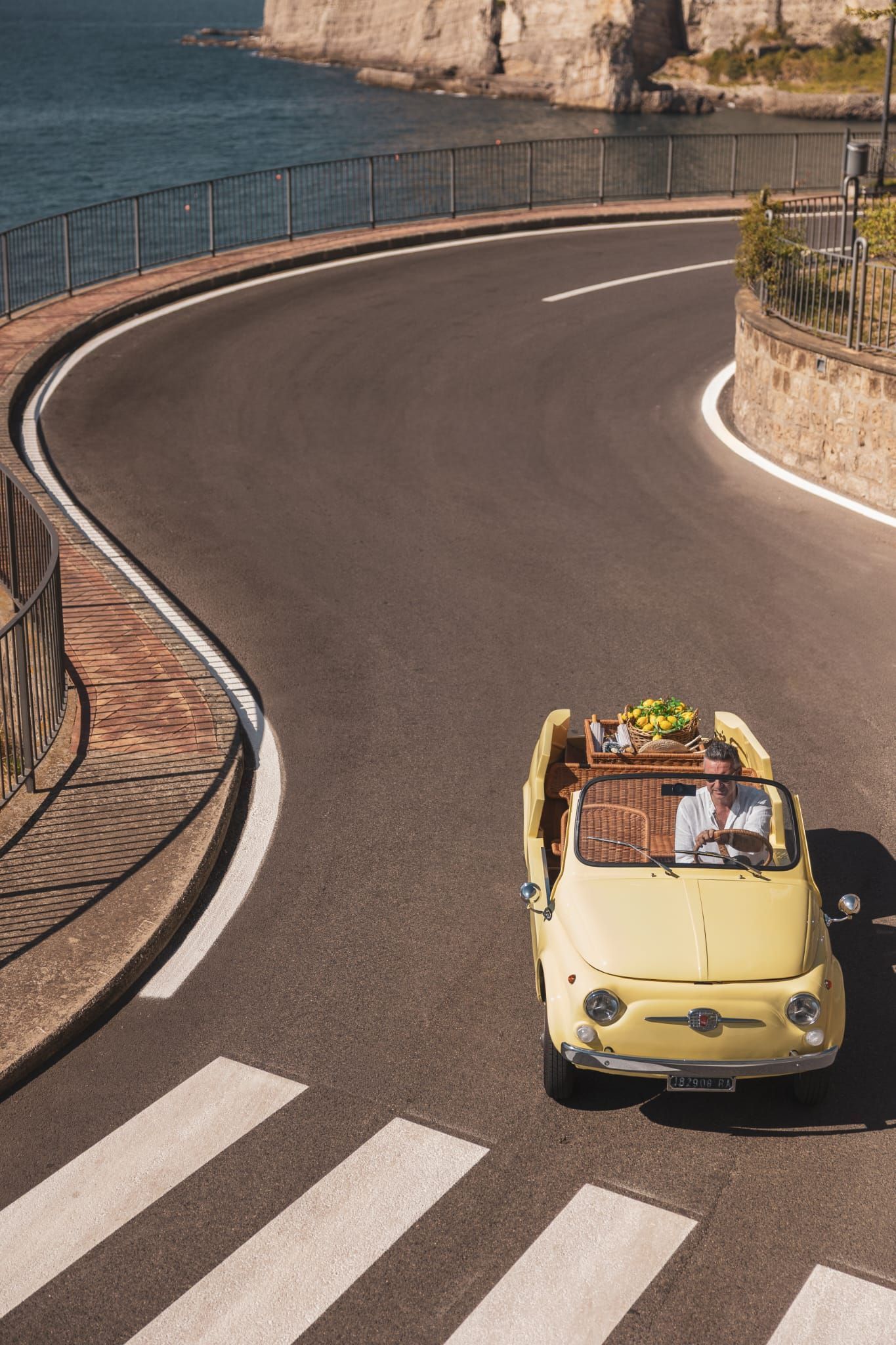 Fiat 500 convertible driving on the Amalfi Coast.