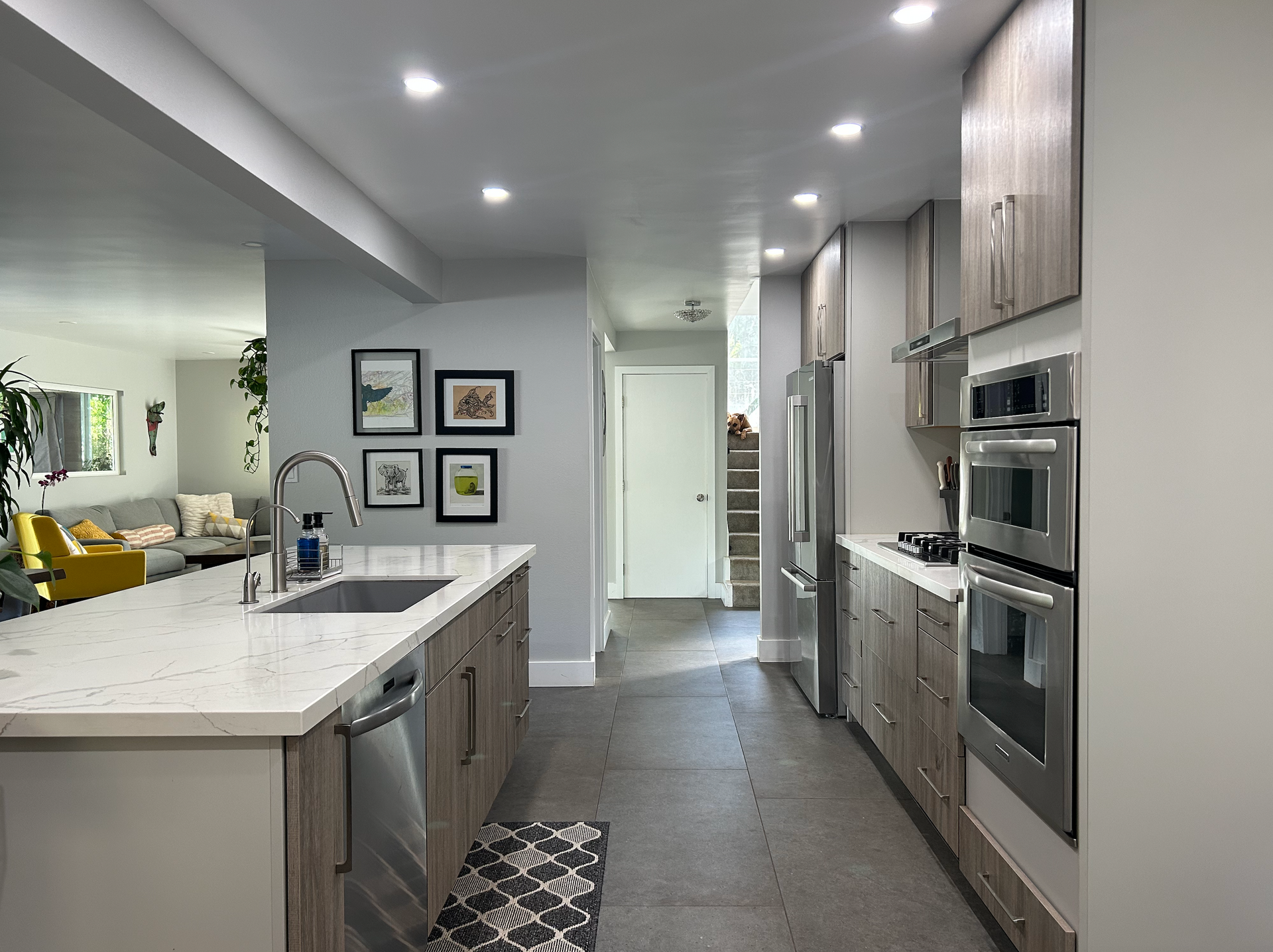 A kitchen with stainless steel appliances and wooden cabinets