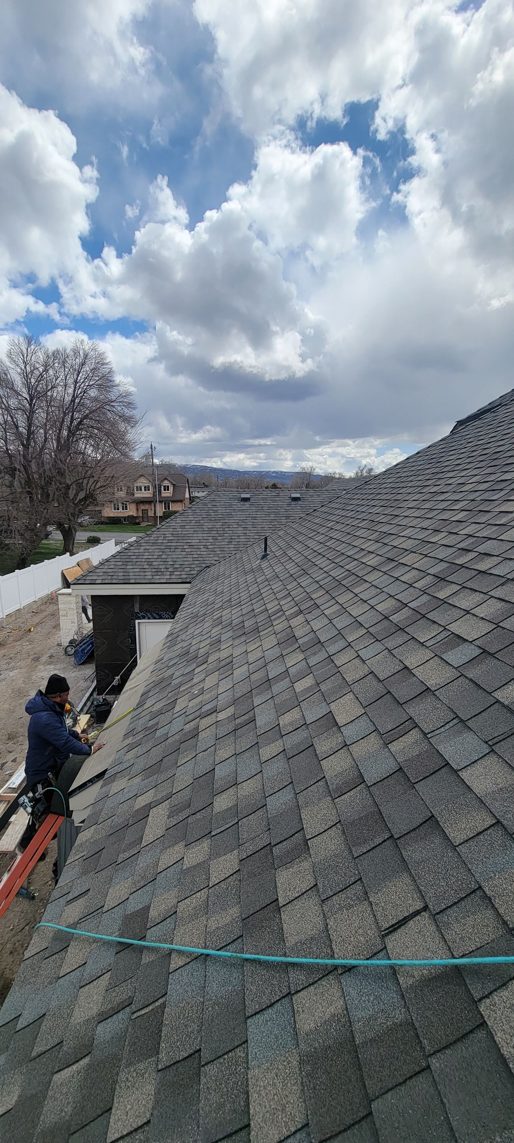 A house is being built with scaffolding around the roof.
