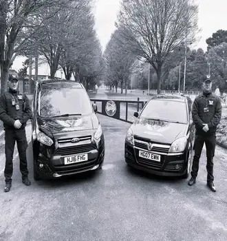 security gauds beside cars