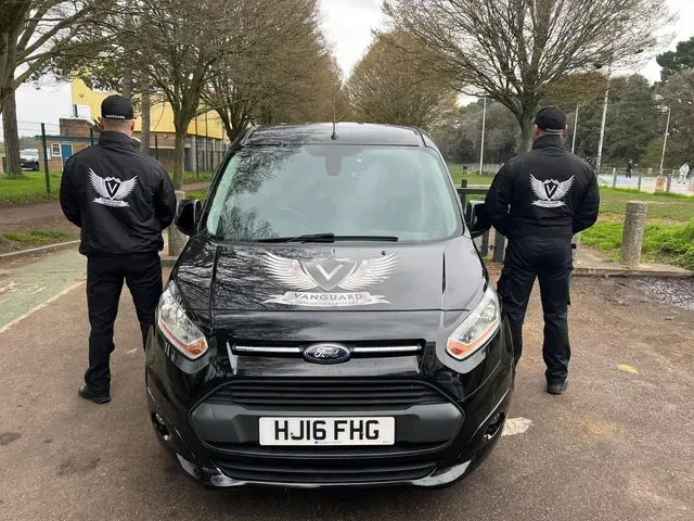 security gauds beside car