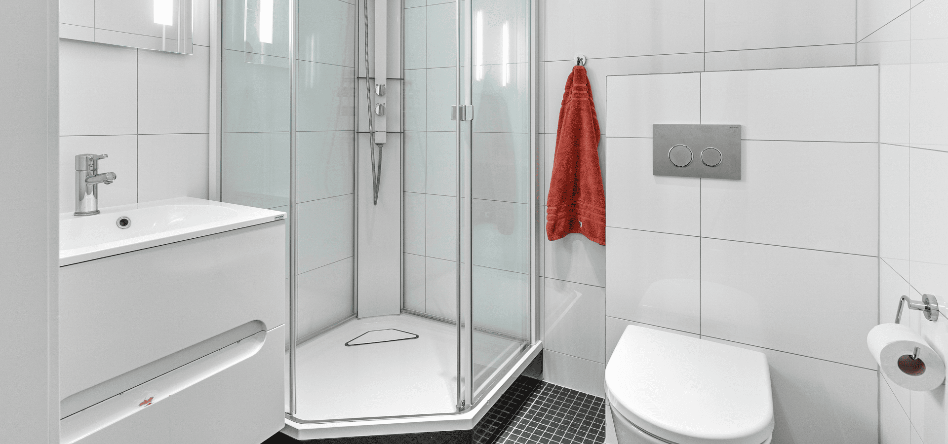 Small bathroom with a compact glass shower enclosure