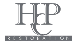 Gray “HHP” logo with “RESTORATION” in spaced white letters on a dark banner below.