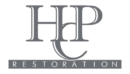 Gray “HHP” logo with “RESTORATION” in spaced white letters on a dark banner below.
