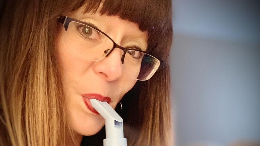 Woman using cystic fibrosis machine