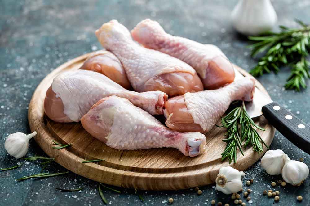 Raw Uncooked Chicken Legs On Wooden Board, Dubbo NSW