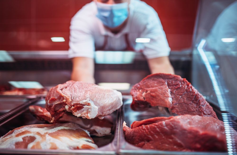 Raw meat on trays in a display cooler — Wholesale Butchery in Bourke, NSW