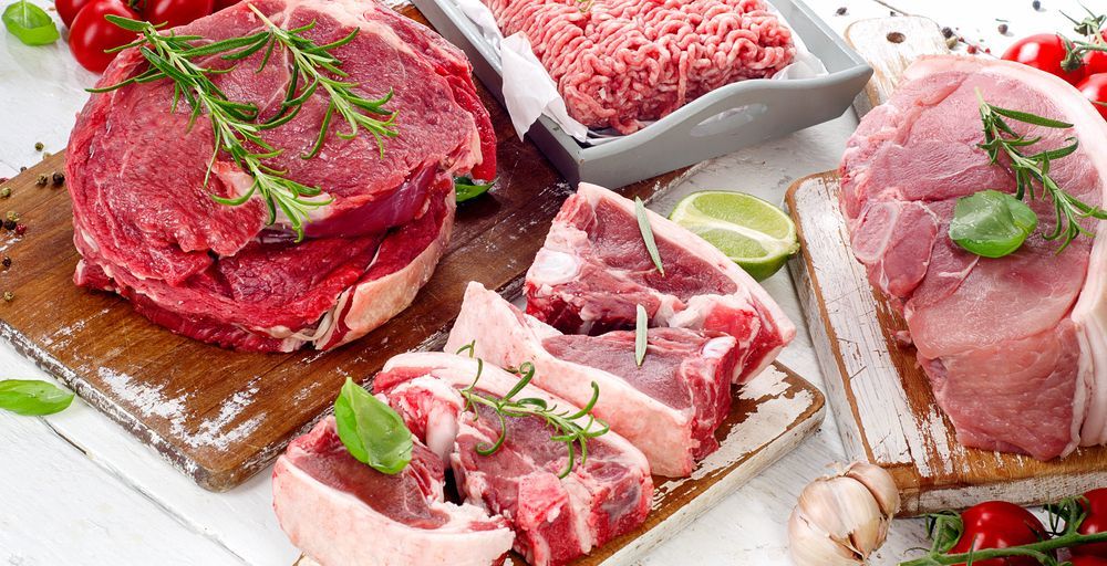 Different types of raw meat with fresh herbs — Wholesale Butchery in Bourke, NSW