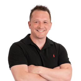 Josh Gwyther, Co-Owner, President of Executive Beauty Suites, smiling in professional head shot