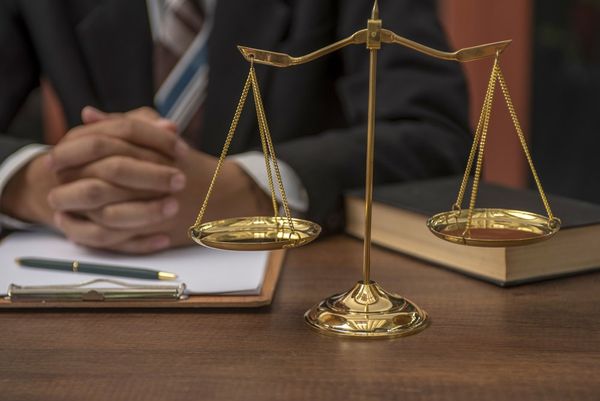 Lawyer With Law Scale — Linares Law Office — Tooele, Utah Lawyer With Law Scale — Linares Law Office — Tooele, Utah