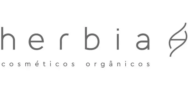 Logotipo da Herbia cosméticos orgânicos apresentando o nome da marca em uma fonte limpa ao lado de um símbolo abstrato em forma de folha.