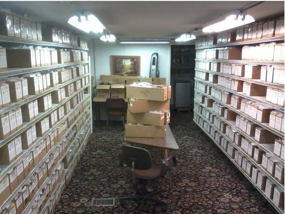 A room with a lot of shelves and boxes on them
