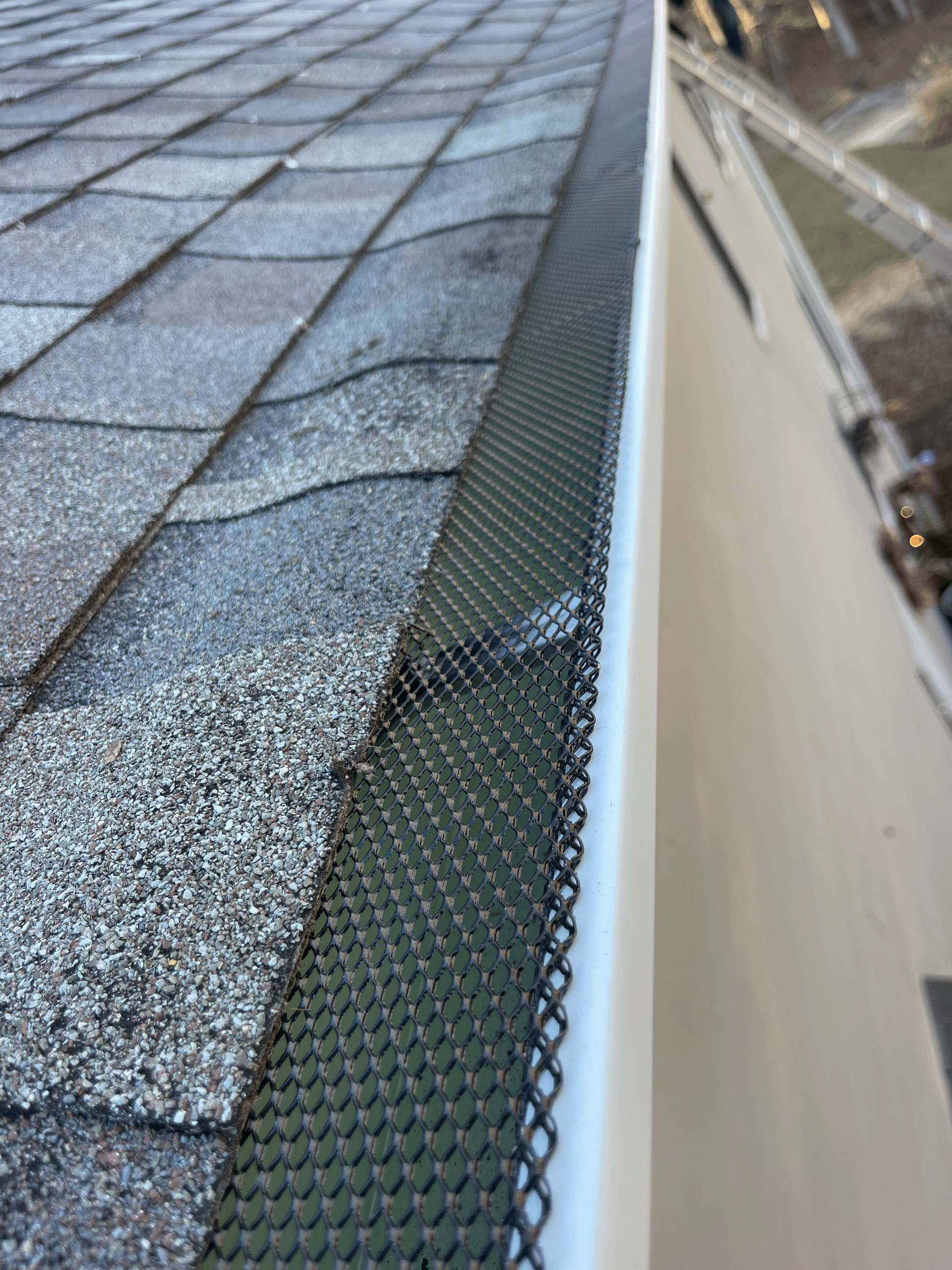 A close up of a gutter on a roof.
