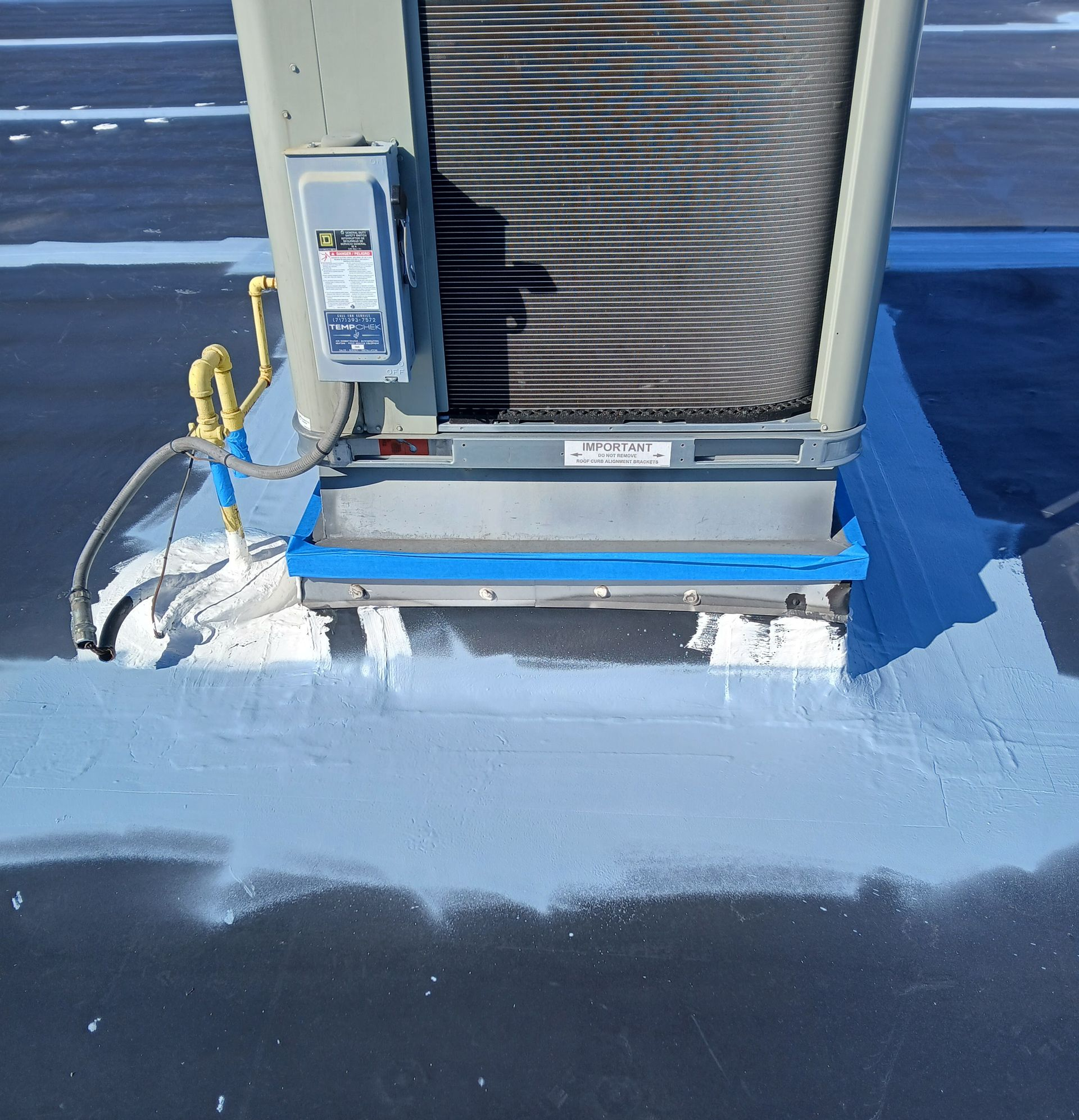 Construction worker in reflective gear walking on solar panels, carrying a toolbox. Construction worker in reflective gear walking on solar panels, carrying a toolbox.