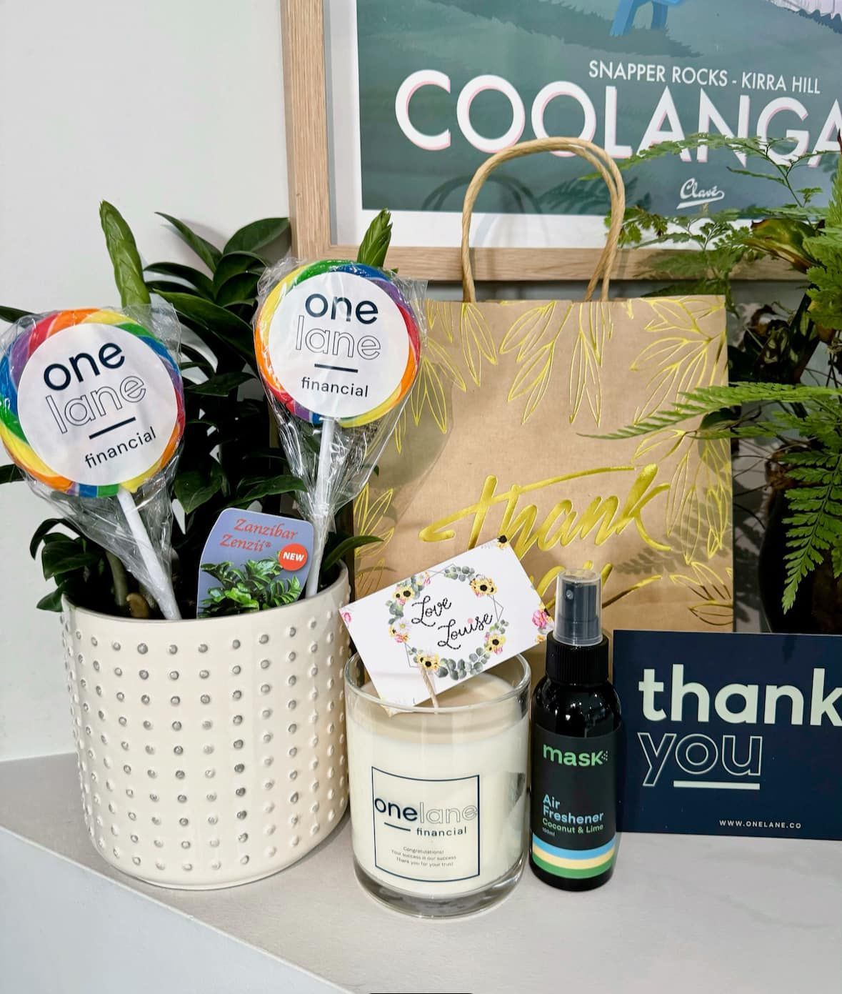 A Table Topped With Candles And A Thank You Sign — One Lane Financial In Burdell, QLD