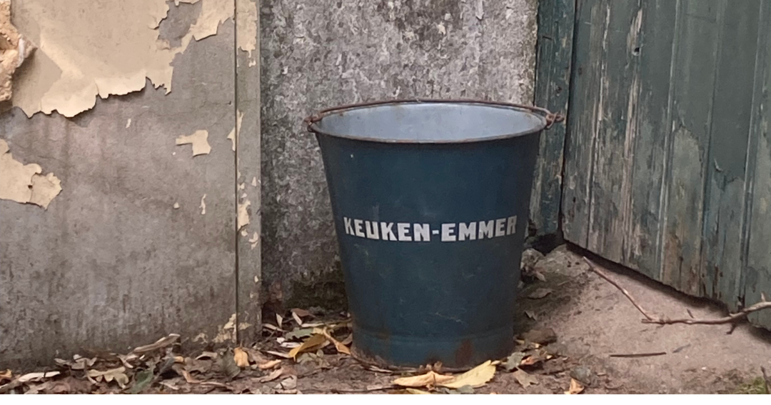 Blue trash can labeled