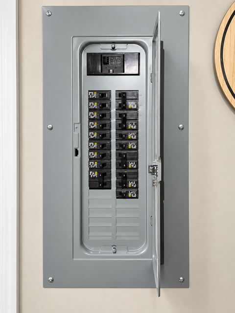 Fuse box with two cylindrical fuses and wiring inside a metal enclosure.