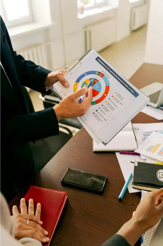 Fractional CFO presenting financial forecasts and growth strategy to a business owner