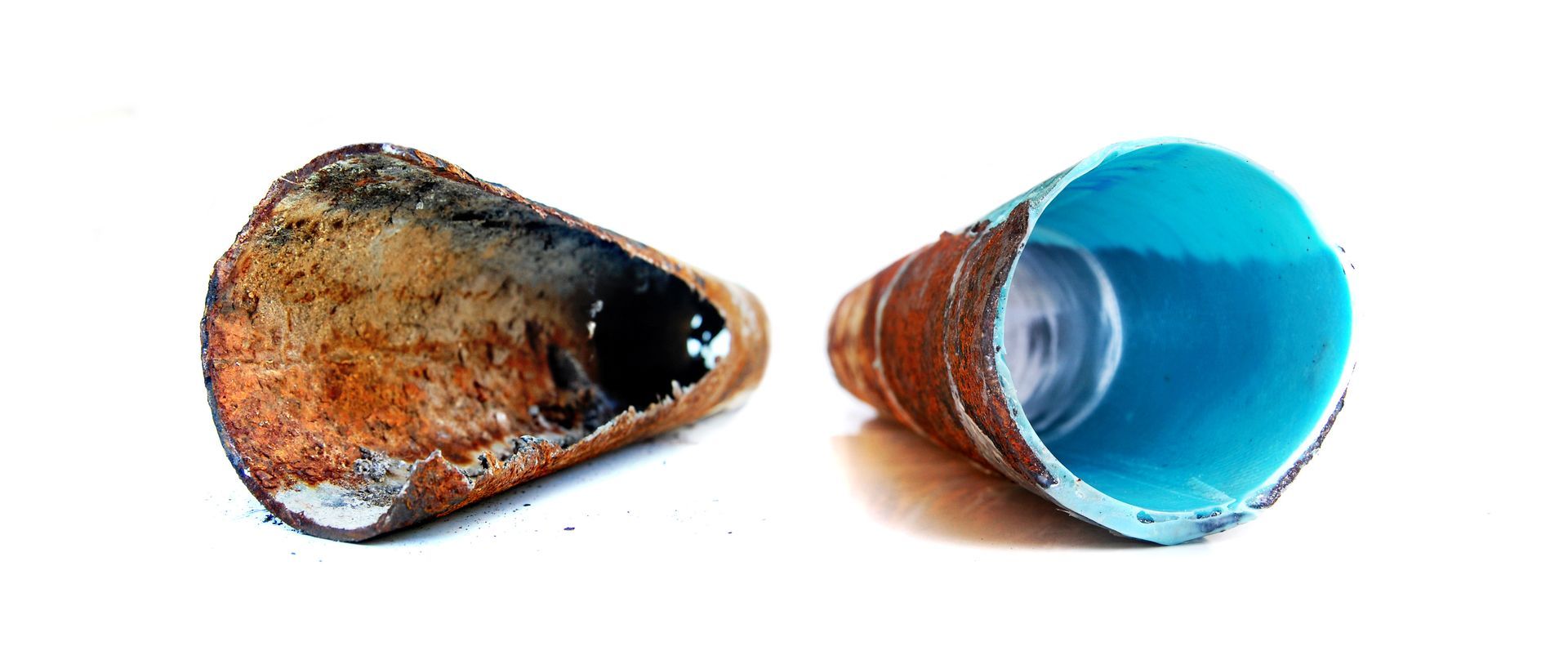 Two seashell halves, one brown and one blue, shown side by side on a white background