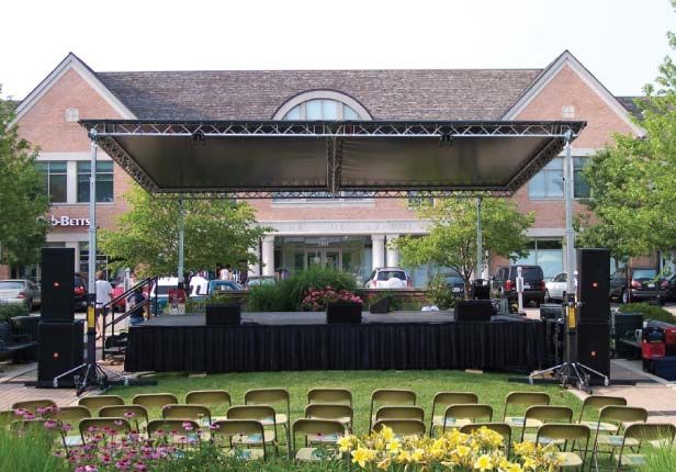 A stage set up in front of a large building