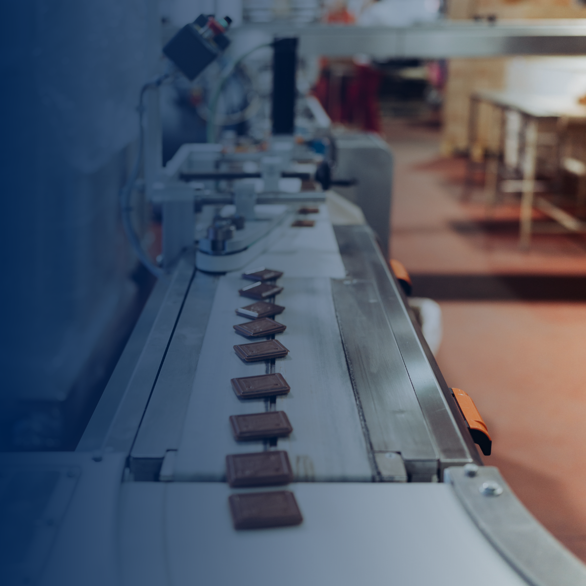 Cookies on a conveyor belt in a factory.