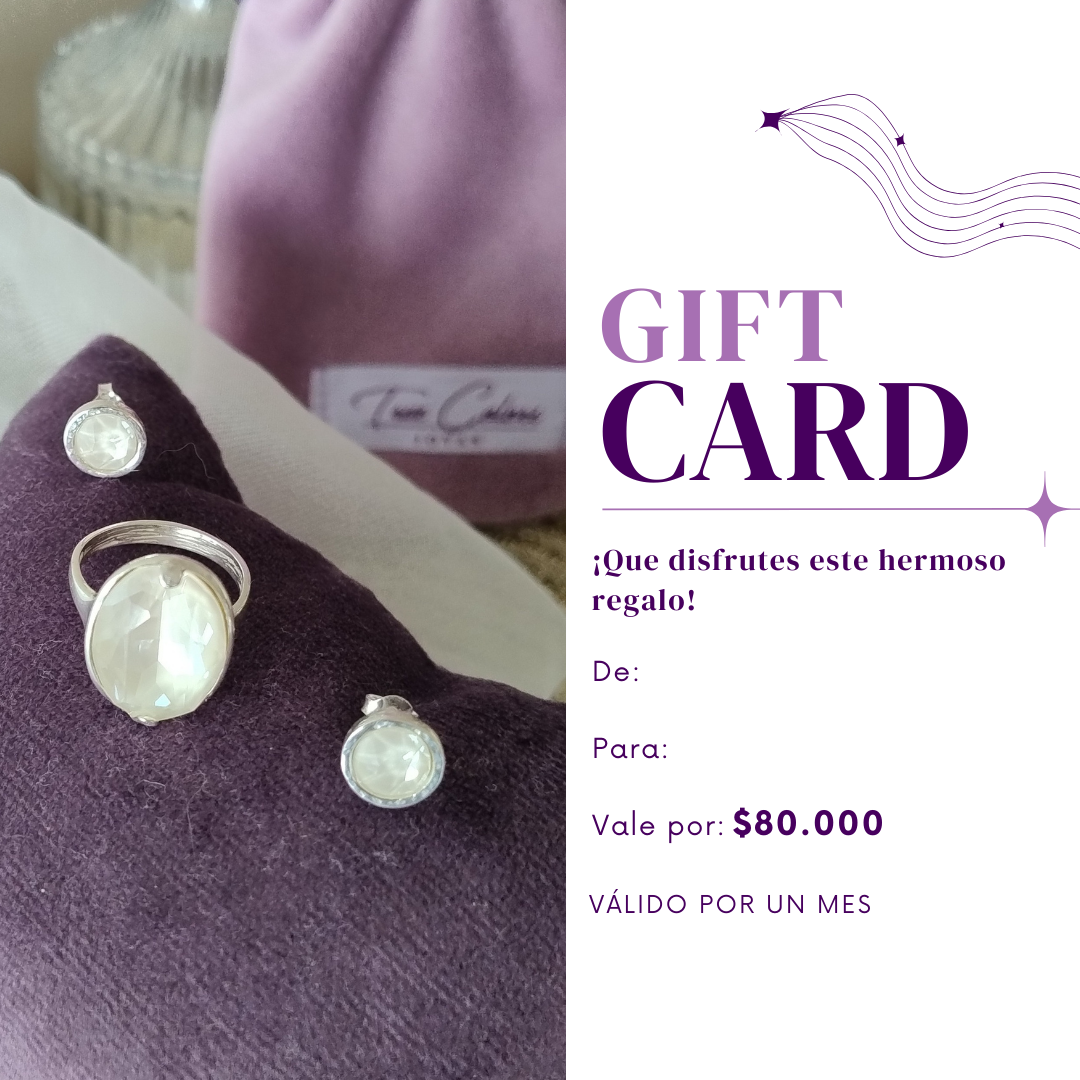 Tarjeta de regalo para la compra de joyas junto a un conjunto de joyas moradas con pendientes y colgante.