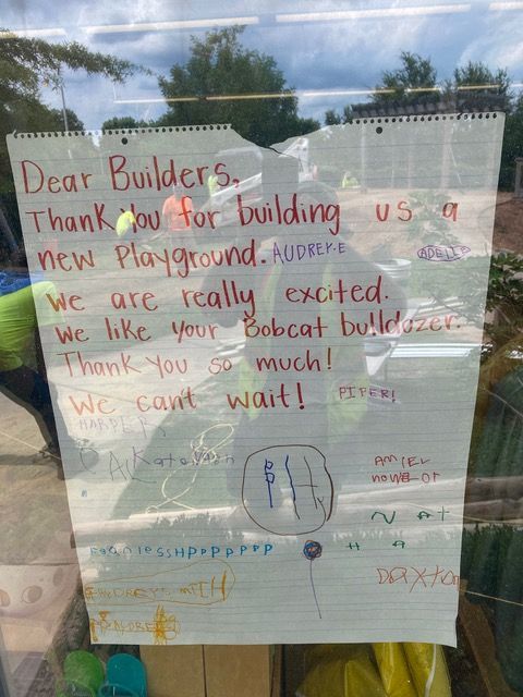 A handwritten note on glass: 