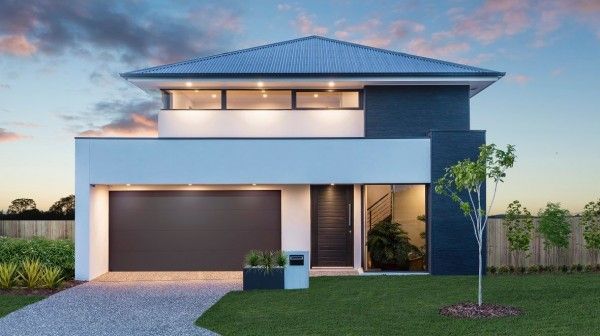 A modern house with a blue roof and a tree in front of it