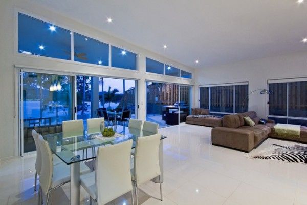 A living room with a dining table and chairs and a couch