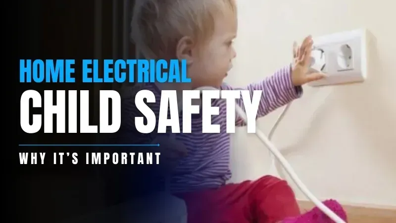 A baby is sitting on the floor and playing with an electrical cord.