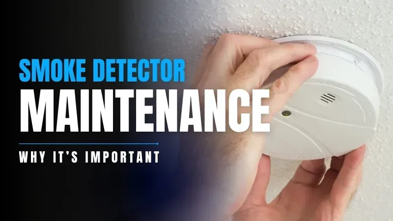 A person is installing a smoke detector on the ceiling.