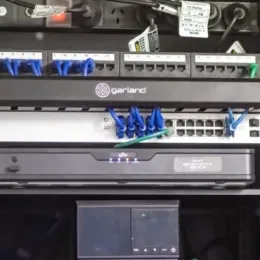 A server rack with a Garland router on top
