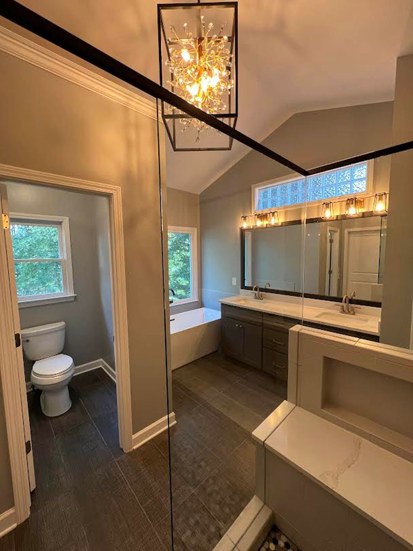 a bathroom with two sinks a toilet and a bathtub