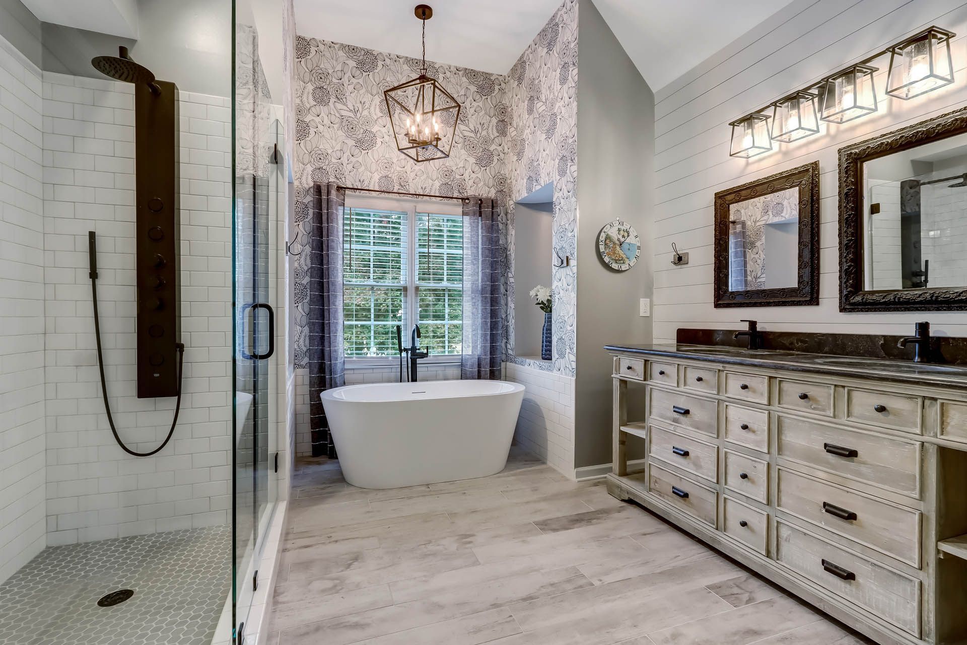 a bathroom with a bathtub and two sinks