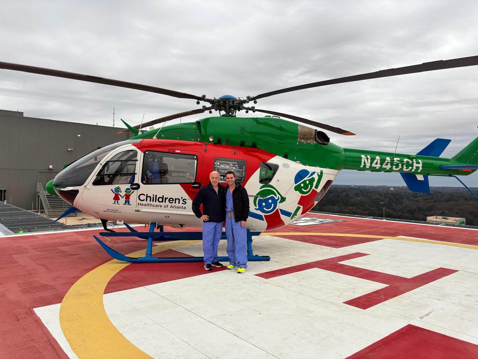 Dr. Andrew Reisner and PNL team on the Arthur M. Blank Hospital helipad