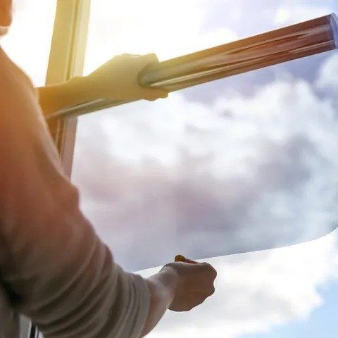 Worker Applying Commercial Window Film Worker Applying Commercial Window Film