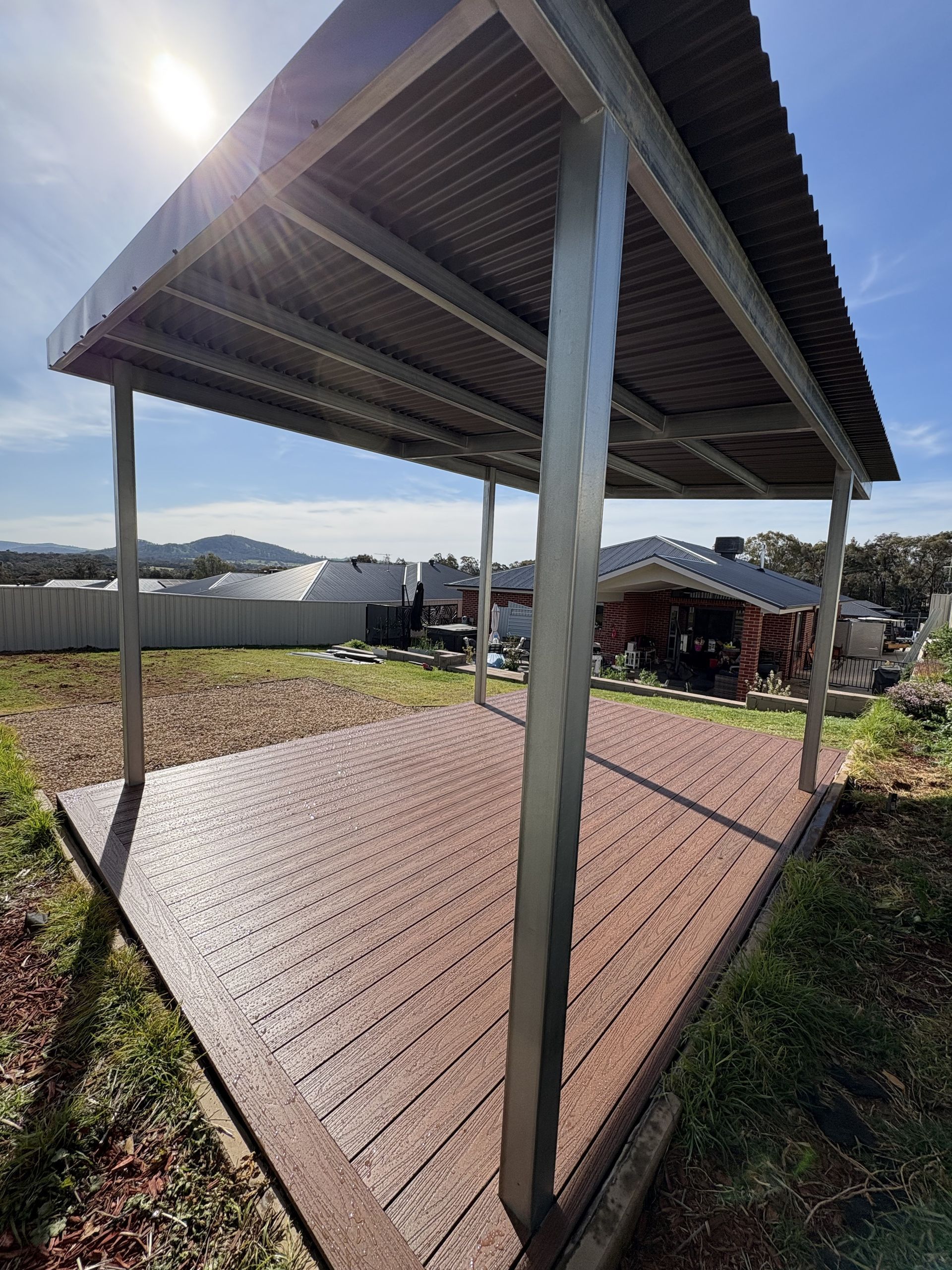 Deck With Corrugated Metal Roof in a Yard — The Wright Way Building In North Albury, NSW