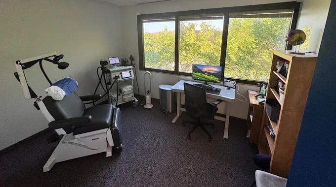 tms therapy device and chair in a comfortable setting at Nexus Neuropsychiatry in Rochester NY