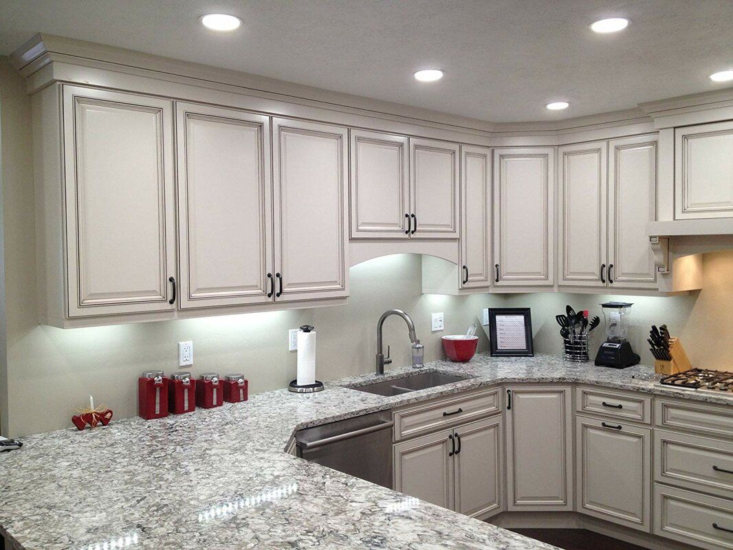 A kitchen with a sink and a faucet on the counter.