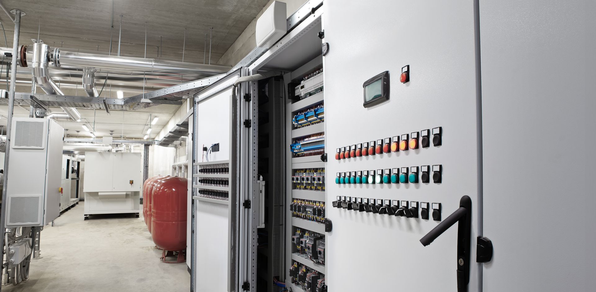 A very large electrical room with a lot of electrical equipment.