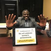 Man holding a sign that says 