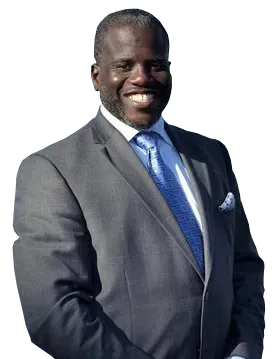 Man in a gray suit, blue tie, smiling; pocket square visible.