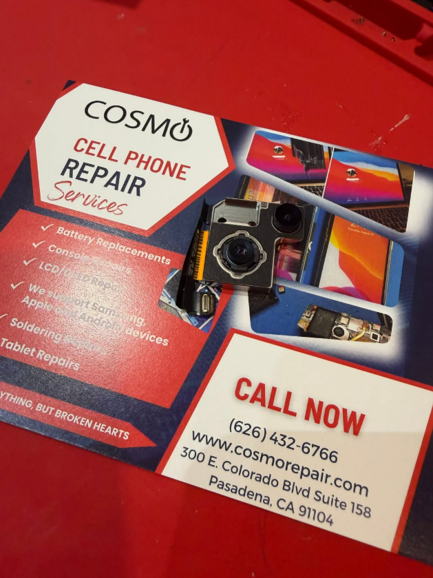 Cosmo cell phone repair flyer on red surface, with black phone and contact number.
